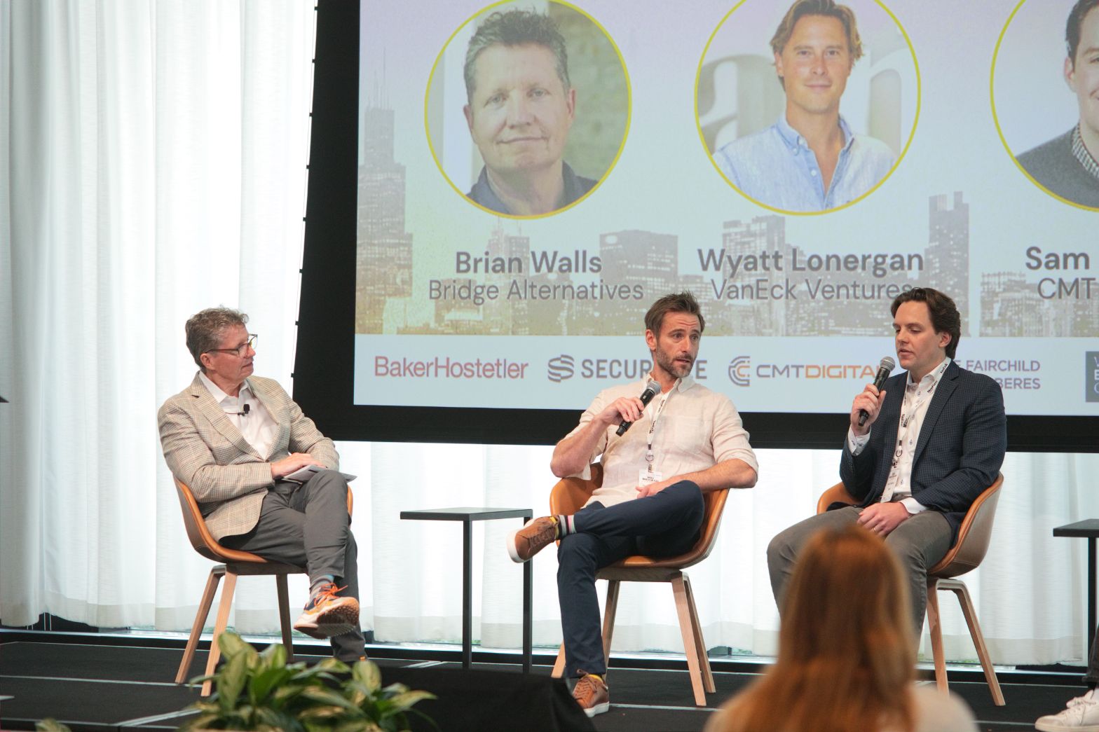 Three State of VC panelists seated on stage, with one speaking into a microphone at Web3 Investor Day 2026
